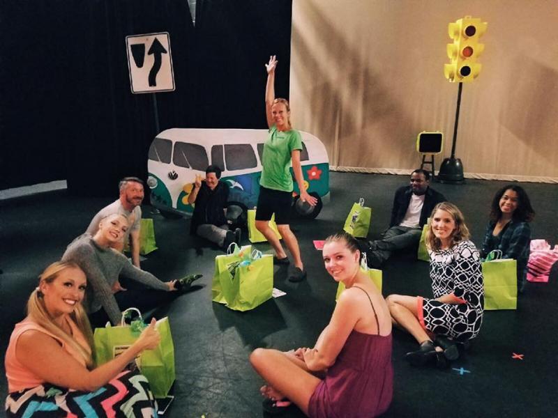 Professional dance teachers lead classes for preschool dance students. 